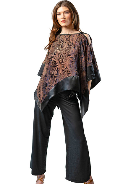 Woman wearing a black and brown patterned top with wide-leg pants on a white background
