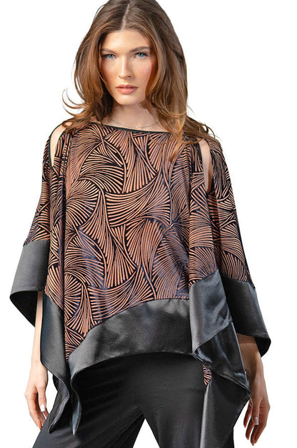 Woman wearing a patterned top and black pants on a white background