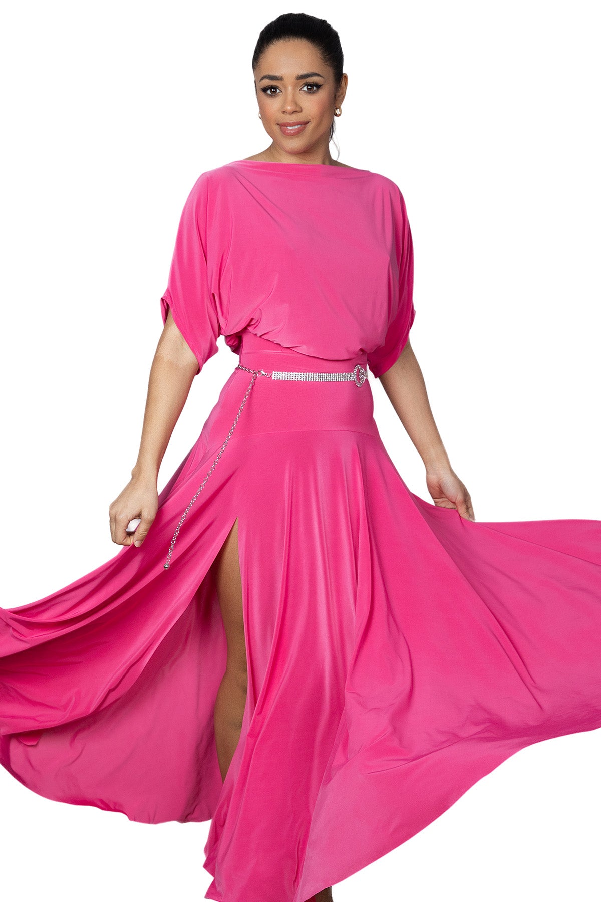 Expertly crafted for the ballroom, the D2402 Simple Long Dress offers a loose top design and a stylish slit in the back for maximum comfort and mobility. Perfect for dancers looking for a simple yet elegant look. Pictured in pink