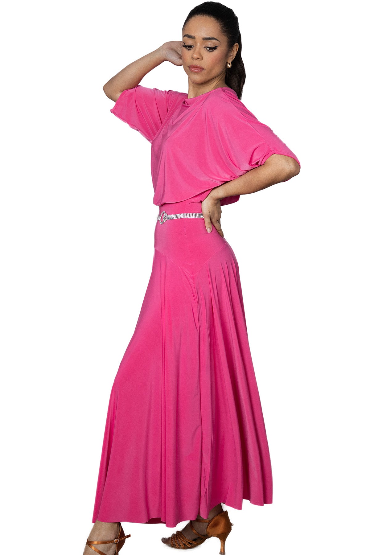 Expertly crafted for the ballroom, the D2402 Simple Long Dress offers a loose top design and a stylish slit in the back for maximum comfort and mobility. Perfect for dancers looking for a simple yet elegant look. Pictured in pink 