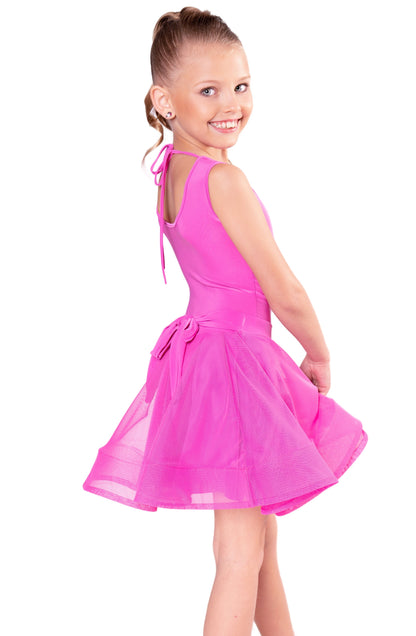 The JR - S1 Girls Mesh Latin Skirt is a regulation skirt designed for young dancers. Its adjustable back bow adds a touch of elegance and versatility. Pair it seamlessly with interchangeable girl's leotards. With 95% Poly and 5% Spandex, it is travel-friendly and wrinkle-resistant for all-day wear. Designed by dancers for dancers, it's perfect for both practice and competition. Production time is only 7-10 business days if an item is not in stock. pictured in pink