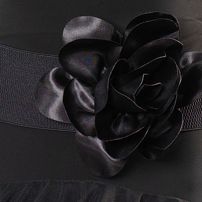 Enhance your Dance America Attire look with the B001 - SILK FLOWER ELASTIC BELT. The matching elastic belt features a large silk flower, adding a touch of elegance to your outfit. Perfect for any performance or event, this belt will elevate your style. pictured in black