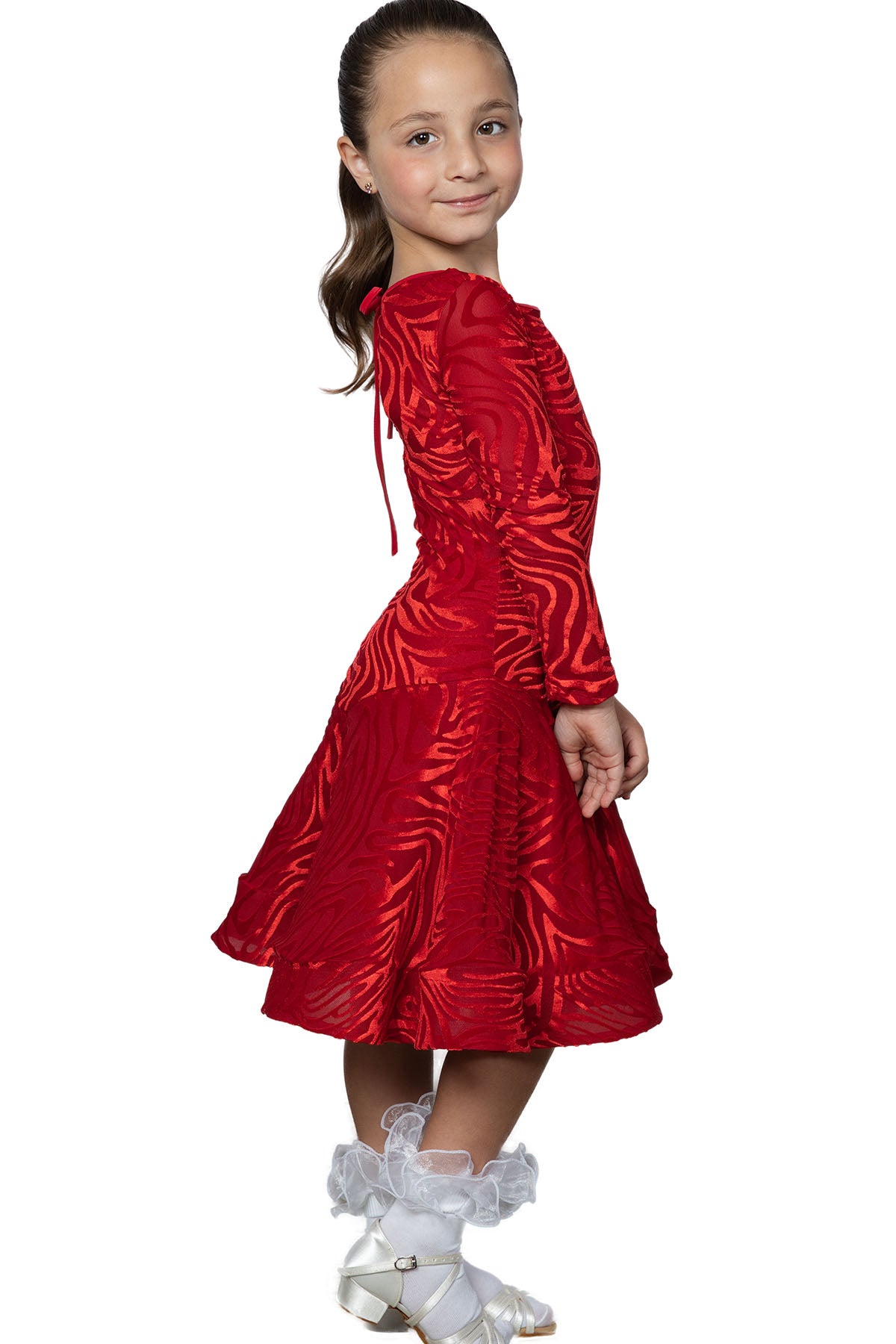 Put your little dance star in the spotlight with this JR - D1V Girls Velvet Latin Dress. Your daughter will feel like a dancing queen as she salsas and twirls in this elegant and comfy dress. The soft velvet fabric and vibrant color will make her stand out on the dance floor. pictured in red