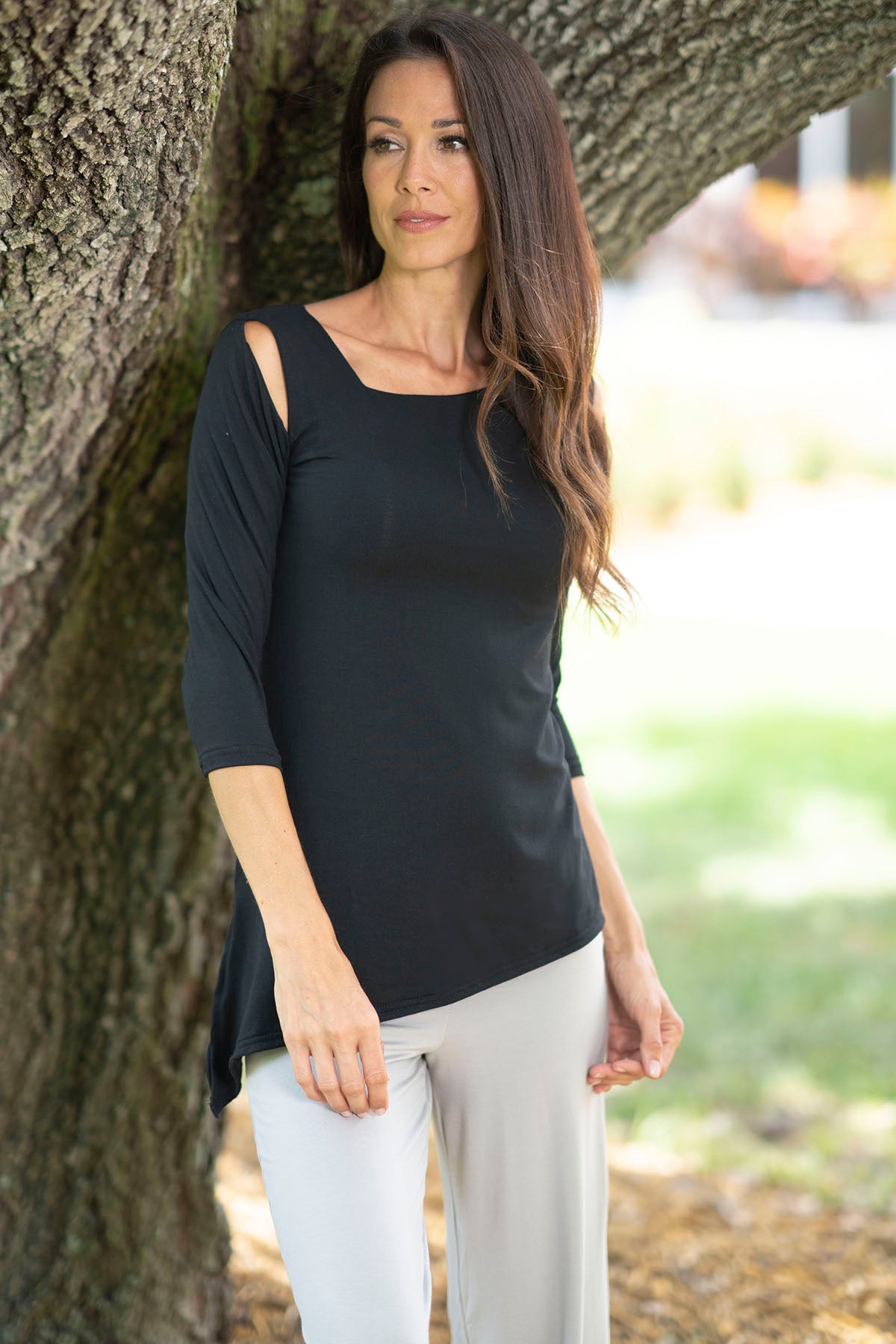 Discover style, comfort, and versatility in our NT4 Peekaboo Top! Perfect for any occasion with its 3/4 sleeves and unique shoulder cutouts. Made from natural fabric that feels soft to the touch. black