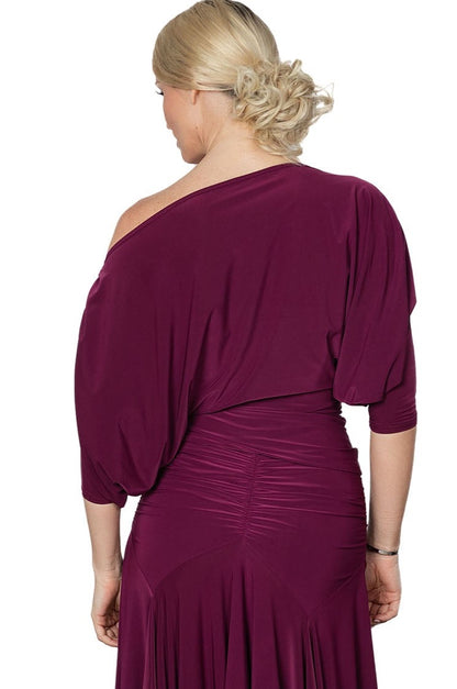 Introducing the T2402Dress Top, designed for ballroom dancers. This top offers a wide fit and flowing design for unrestricted movement and maximum comfort. Perfect for any dance routine, this top will keep you looking elegant and feeling confident on the dance floor.wine