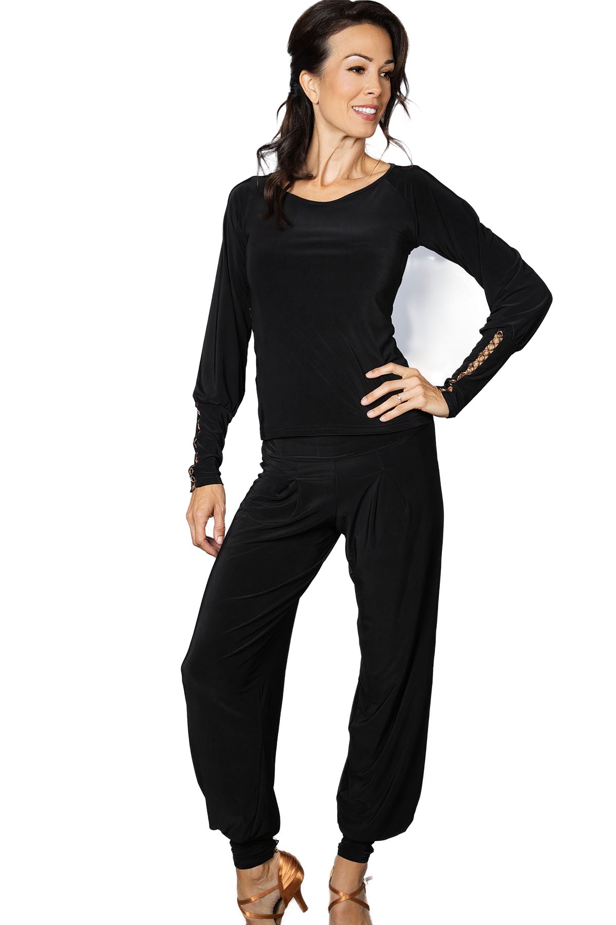 P2402 Circle Embellished Harem Pants  Effortlessly elevate your ballroom wardrobe with our P2402 Circle Embellished Harem Pants. The wider cut and ankle cuff, adorned with a golden grommet trim, create a playful and stylish look. Perfect for those who want to make a statement on the dance floor. black