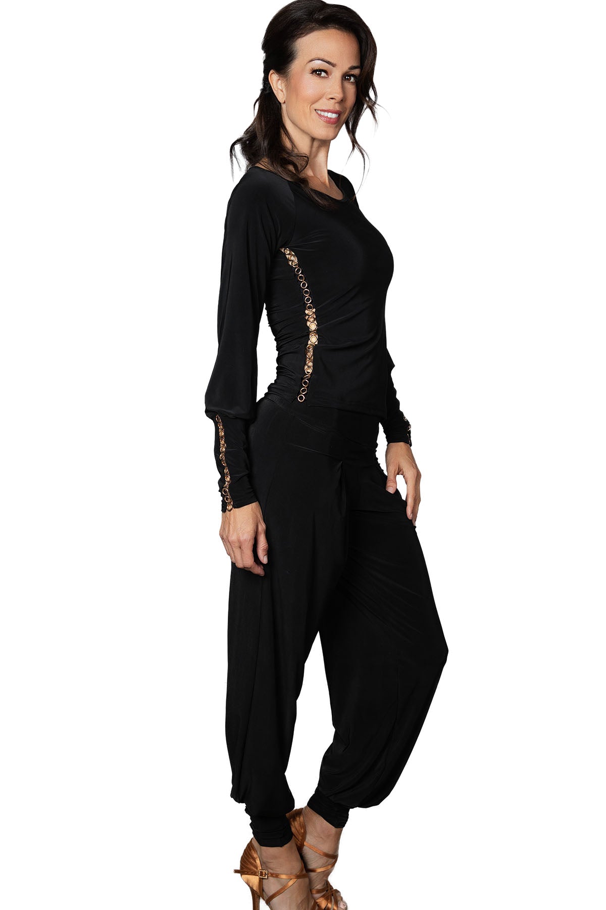 P2402 Circle Embellished Harem Pants  Effortlessly elevate your ballroom wardrobe with our P2402 Circle Embellished Harem Pants. The wider cut and ankle cuff, adorned with a golden grommet trim, create a playful and stylish look. Perfect for those who want to make a statement on the dance floor. black