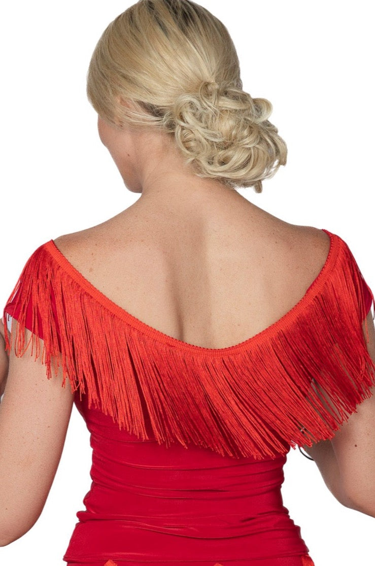 T2441 Fresco Fringe Top  Indulge in luxurious fashion with our T2441 Fresco Fringe Top. This exquisite top boasts 6 inches of stretchable fringe, adding movement and texture to your look. Elevate your style with this exclusive and tasteful piece. Perfect for a night out or a sophisticated event. red