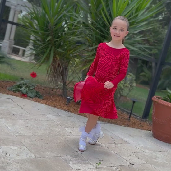 child modeling junior dress in red