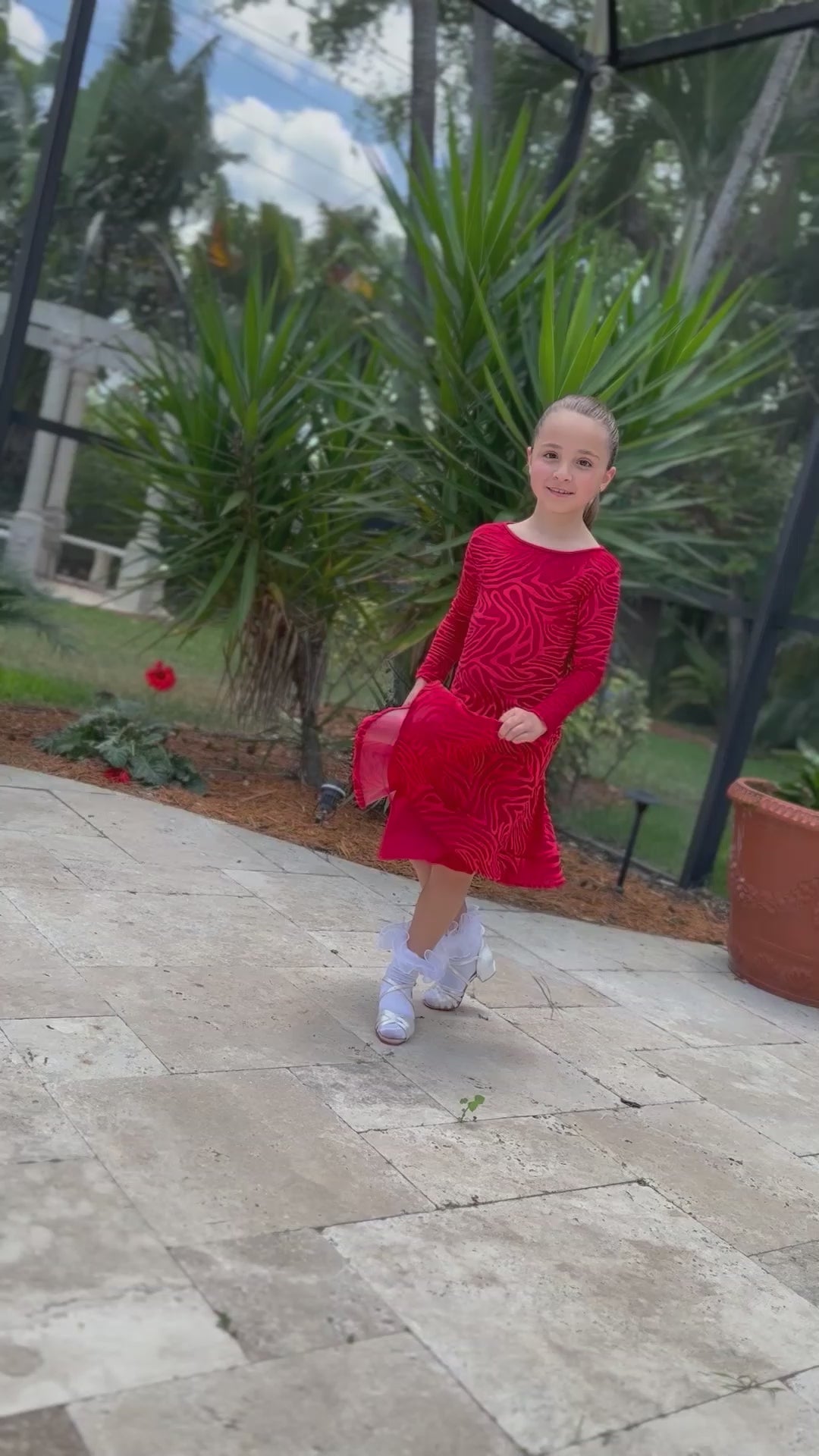 child modeling junior dress in red