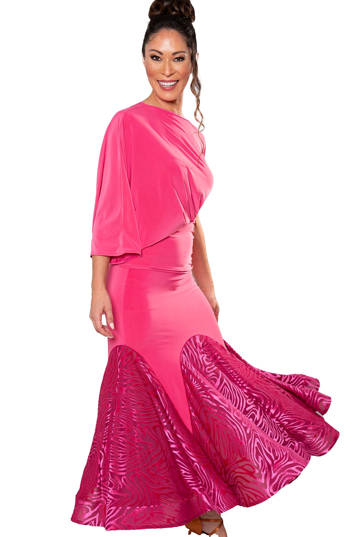 Get ready to steal the show with the S207 Long Velvet Godet Skirt! This unique dance skirt features a long velvet inset, creating a beautiful and flowy silhouette. Feel confident and stunning as you move across the dance floor in this must-have piece. pink