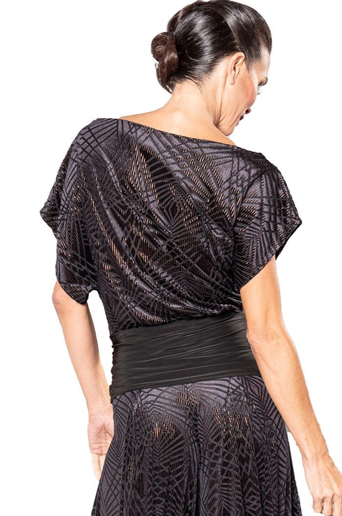 Indulge in the simplicity and versatility of the T2450 High Waisted Copper Ballroom Dance Top. This elegant top features a fashionable high waist and interchangeable skirt and pants, allowing you to effortlessly transition from day to night. The luxurious two-tone black and copper velvet is sure to turn heads and elevate your style. pictured from back