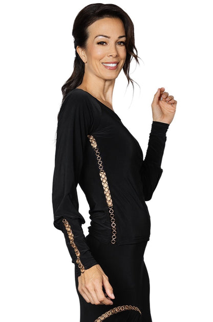 Achieve a unique and elegant look with our T2404 Gold Cycle Embellished Top. Perfect for ballroom dancing, this top features gold grommet trim that adds a touch of glamour to your outfit. Stand out on the dance floor and make a statement with this must-have piece.black