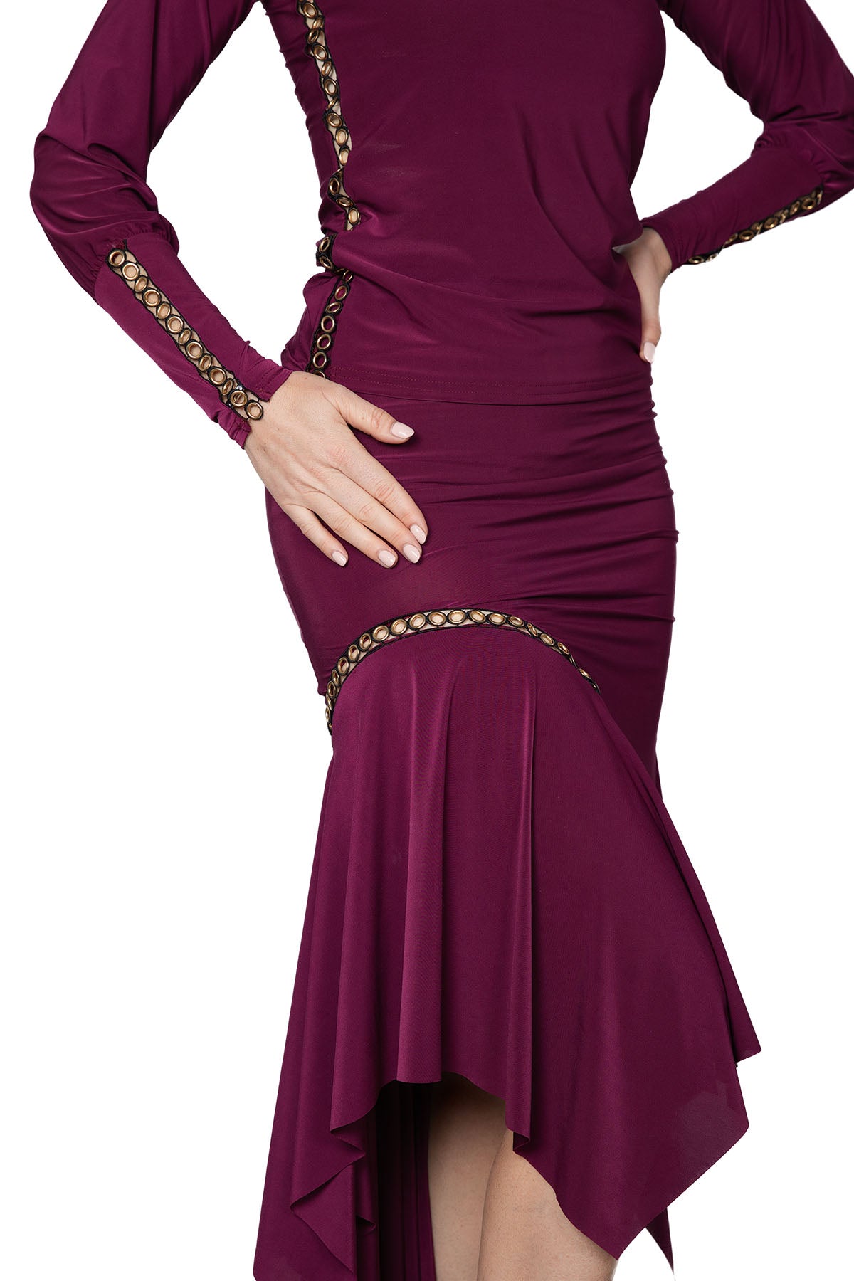 S2415 Circle Embellished Skirt  Introducing our S2415 Circle Embellished Skirt - perfect for ballroom babes! This mid-length slim bell-shaped skirt is adorned with gold grommet trim for a touch of glamour. Twirl and dance the night away with ease and style in this unique and chic skirt. Wine