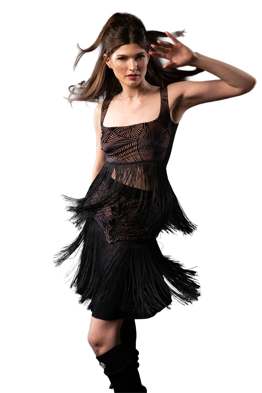Woman wearing a black fringe dress with a white background