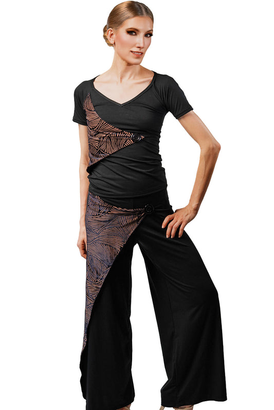 Woman wearing a black outfit with patterned design on a white background