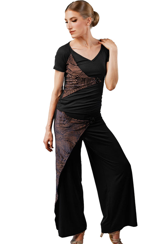 Woman wearing a black and brown patterned outfit on a white background